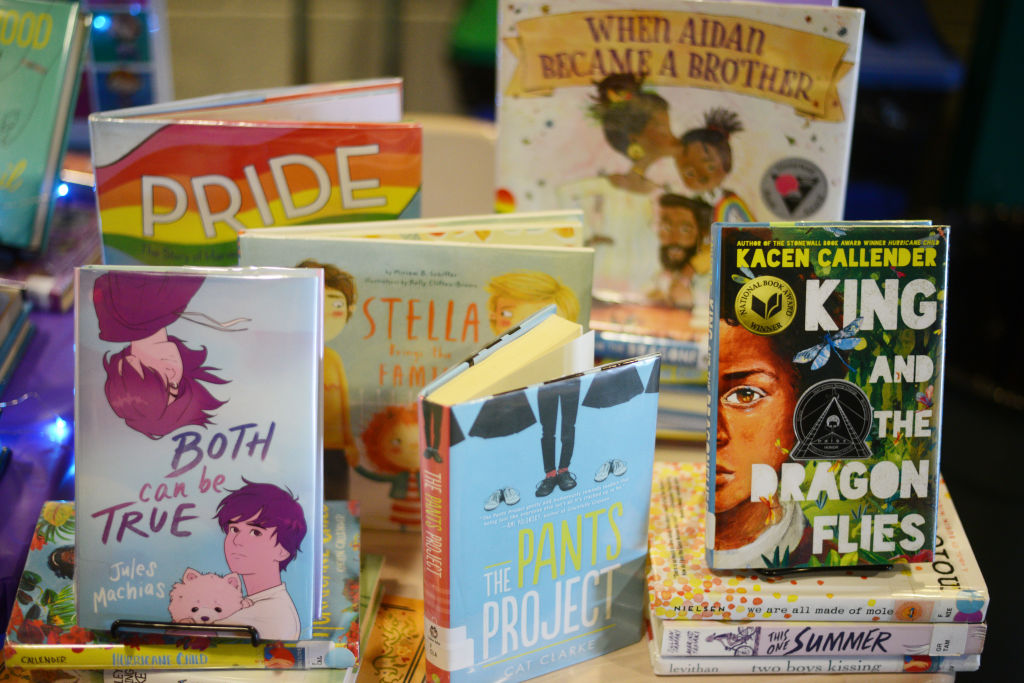 Children books that are fighting for survival at public schools because of their LGBTQ content are displayed at the annual Pride Town Hall at Walter Johnson High School in Bethesda, MD