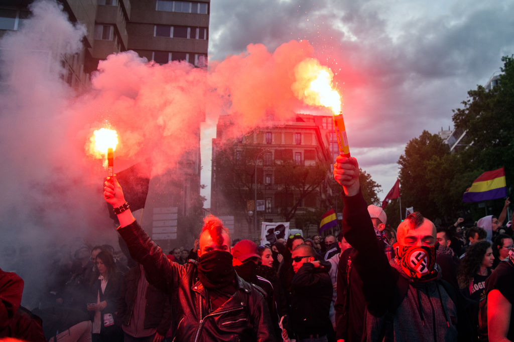 Masked left-wing protesters riot in the streets of Madrid, Spain