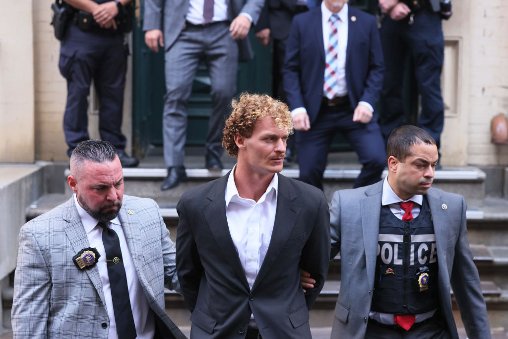 Daniel Penny is led away in handcuffs by police after being charged with second degree manslaughter on June 14.