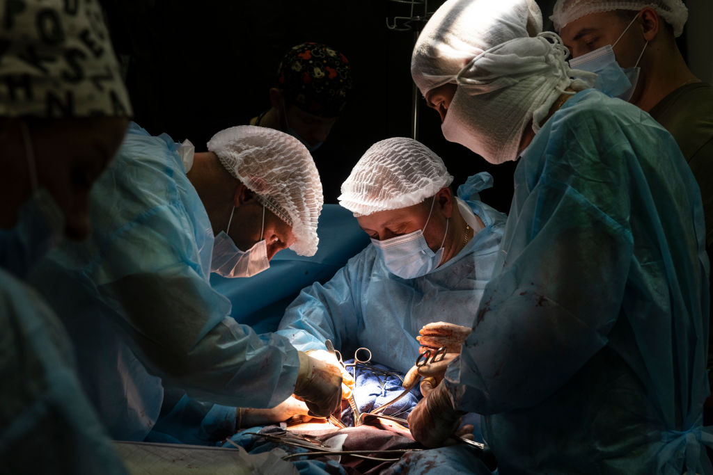 Doctors performing abdominal surgery in a hospital