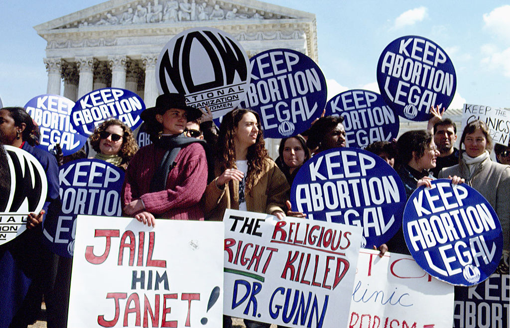 A group of women on the steps of the Supreme court, including some representing the National Organization of Women, protest the murder of Dr. David Gunn by Michael Griffin.