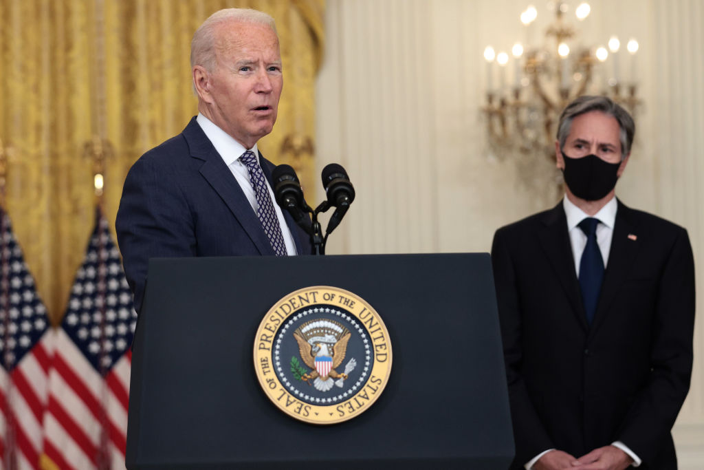 U.S. President Joe Biden gestures to Secretary of State Antony Blinken as he gives remarks on the U.S. military’s ongoing evacuation efforts in Afghanistan from the East Room of the White House on August 20, 2021 in Washington, DC.