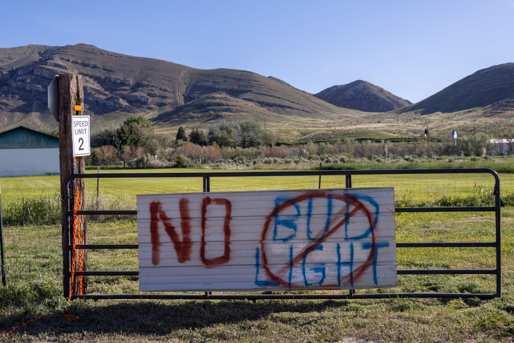 ARCO, IDAHO - JUNE 22: Anti-Bud Light beer graffiti is seen scrawled on a gate on June 21, 2023 in Arco, Idaho. Bud Light parent company AB InBev, the largest beer producer by volume in the world, ran afoul of core drinkers after an effort to broaden appeal through a promotion that included transgender influencer Dylan Mulvaney backfired, resulting in sales to plummet nearly 30 percent, according to published reports.