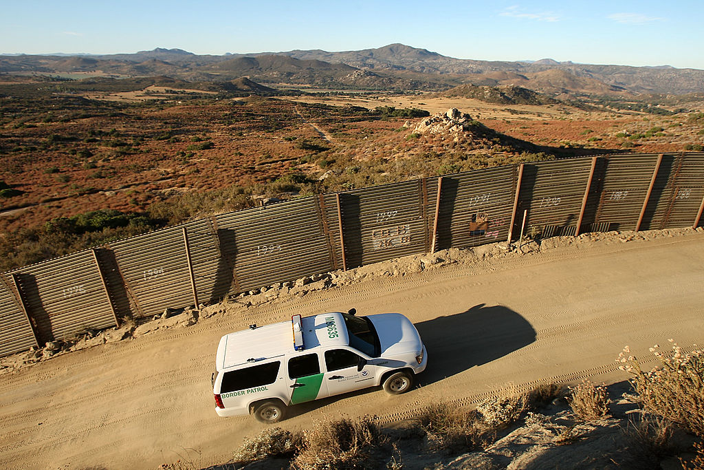 US Border Patrol agents carry out special operations near the US-Mexico border fence following the first fatal shooting of a US Border Patrol agent in more than a decade on July 30, 2009 near the rural town of Campo, some 60 miles east of San Diego, California. 30-year-old agent Robert Rosas was killed on July 23 when he tracked a suspicious group of people alone in remote brushy hills north of the border in this region.