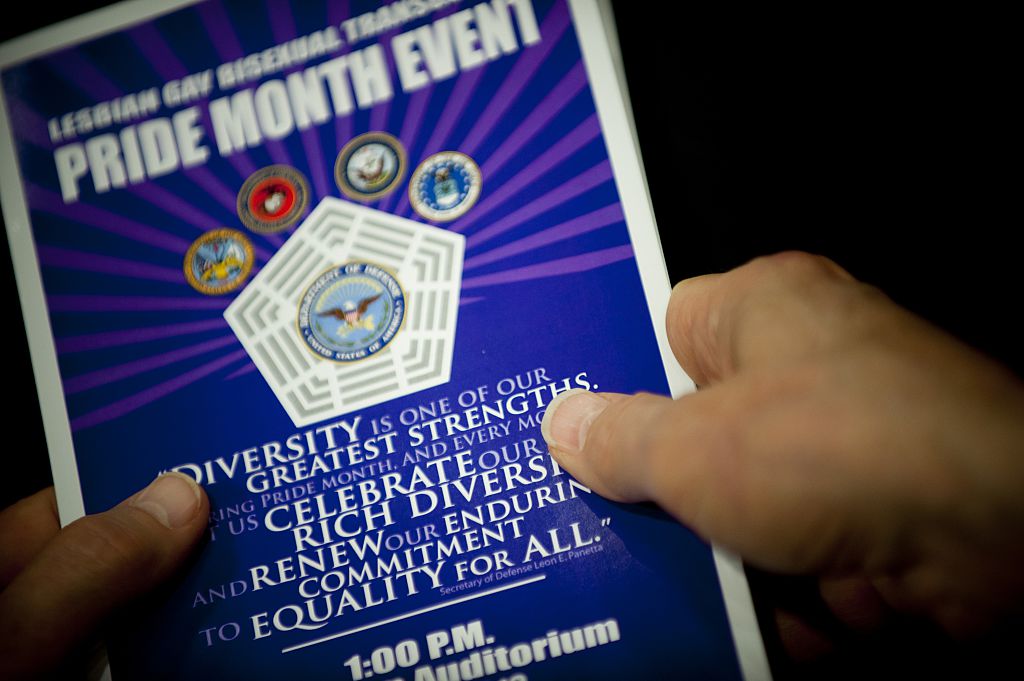 Close up of hands holding a pamphlet at the Pentagon during a Lesbian, Gay, Bi-Sexual, and Transgender Pride Month event. DOD photo by U.S. Navy Petty Officer 1st Class Chad J. McNeeley. 2015.