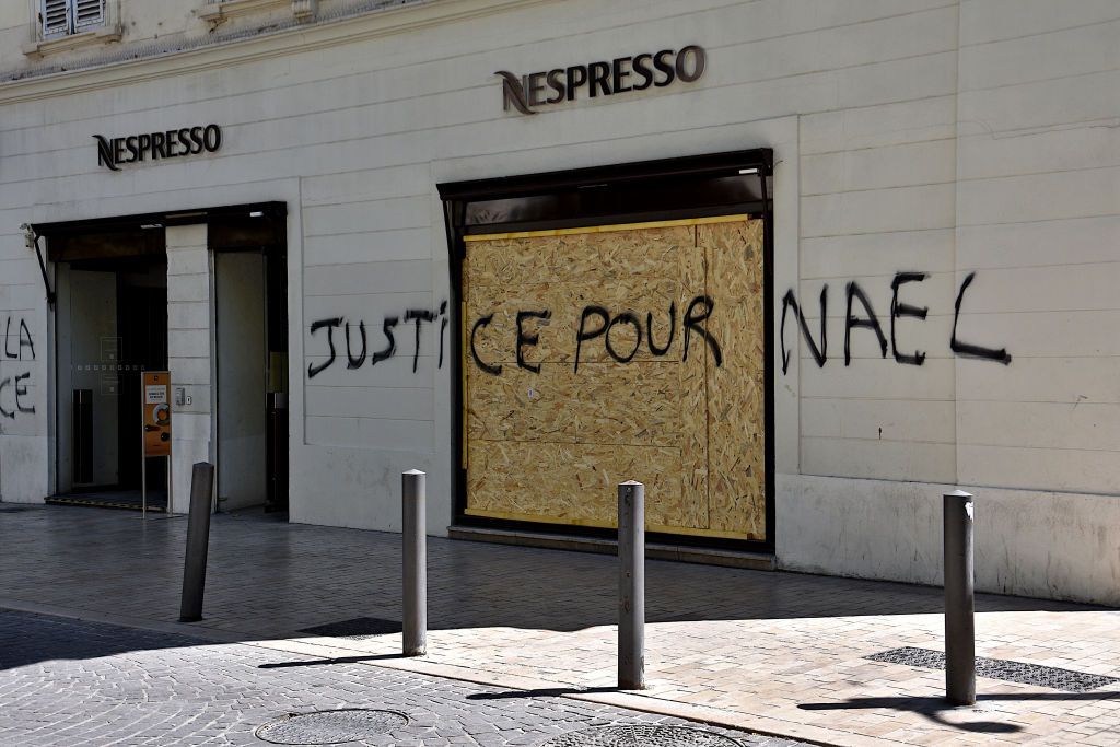 A message "Justice for Nahel" spray painted on the facade of a store by rioters in Marseille. After four consecutive nights of riots, many stores and building suffered considerable damage in Marseille and many other French cities. Police arrested 1,311 people nationwide. The unrest was sparked by the death of Nahel, a 17-year-old who was shot by police during a traffic stop in Parisian suburb of Nanterre on June 27, 2023.