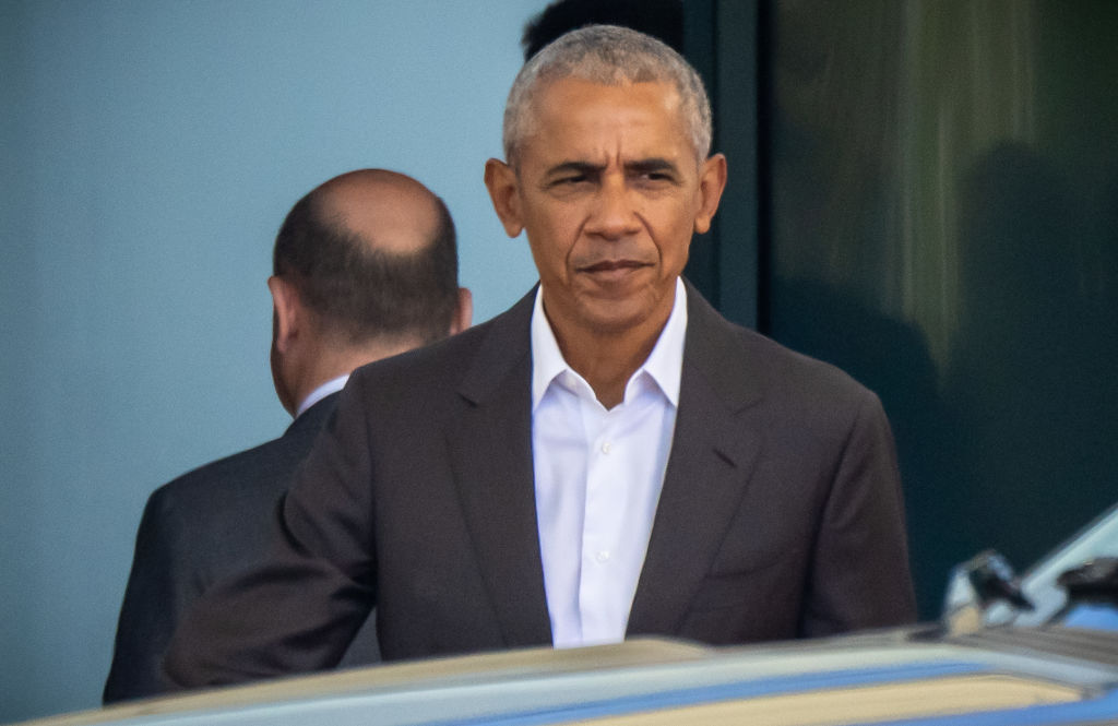 Former US President Barack Obama is seen off by German Chancellor Olaf Scholz at the Federal Chancellery.