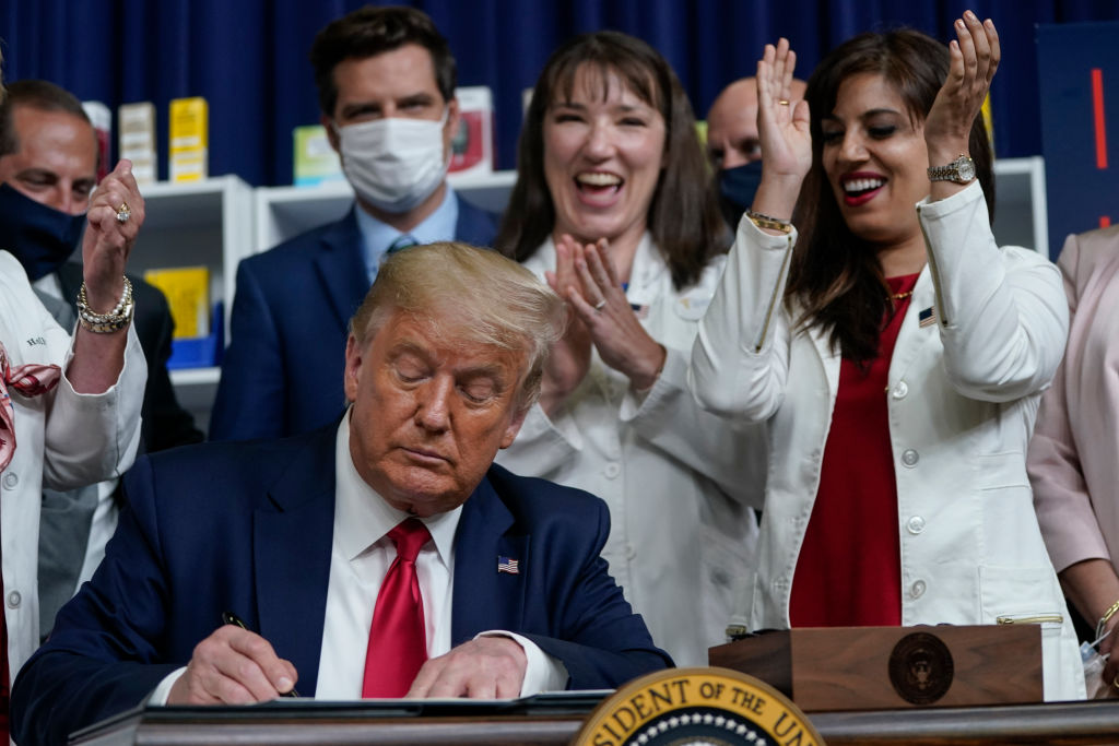 U.S. President Donald Trump signs executive orders on prescription drug prices in the South Court Auditorium at the White House on July 24, 2020 in Washington, DC.