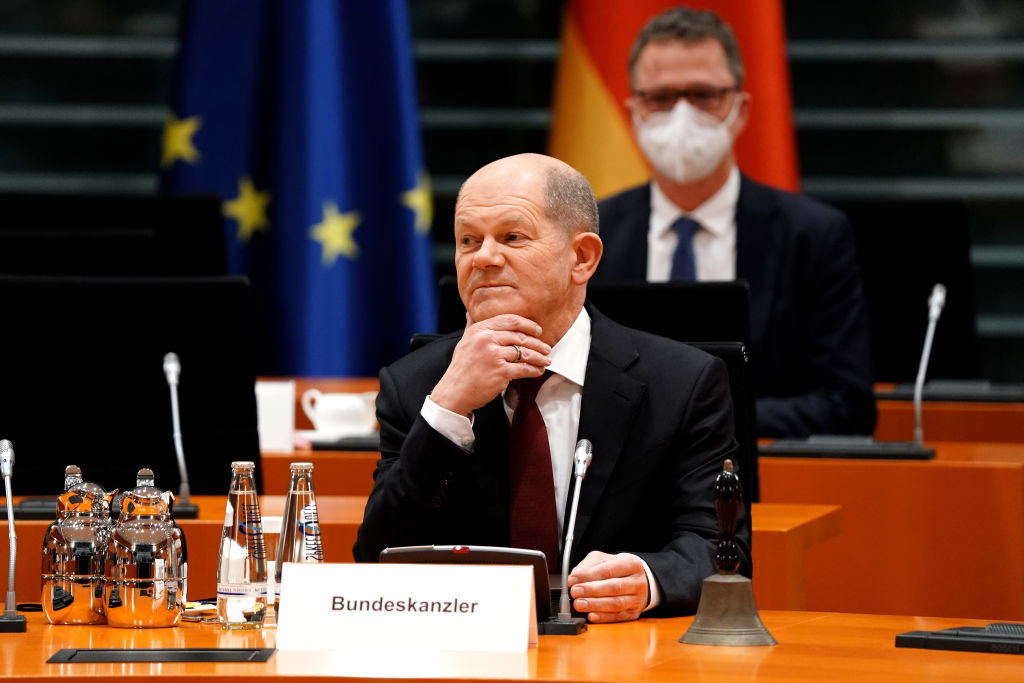 German Chancellor Olaf Scholz sits at the table during the first cabinet meeting of new German government at the Chancellery on 8th December, 2021 in Berlin, Germany.