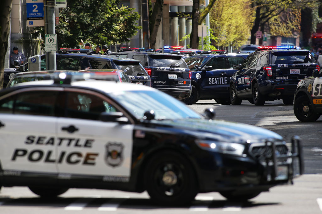 Officers respond after two Seattle Police Department officers were shot while responding to a robbery in downtown Seattle on Thursday, April 20, 2017.