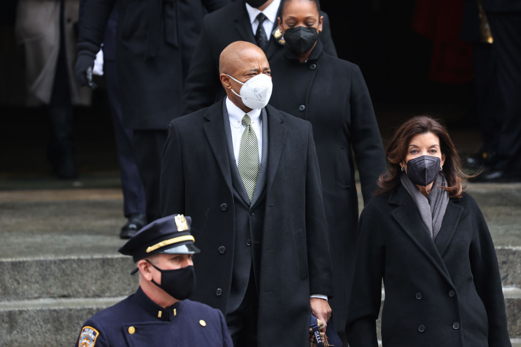 New York City Mayor Eric Adams and New York Governor Kathy Hochul leave the funeral for fallen NYPD officer Wilbert Mora at St. Patrick's Cathedral on February 02, 2022 in New York City.