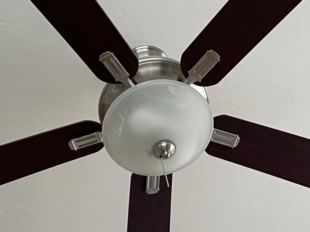 Low-angle close-up of a ceiling fan on the ceiling of a domestic home in Lafayette, California, March 24, 2022.