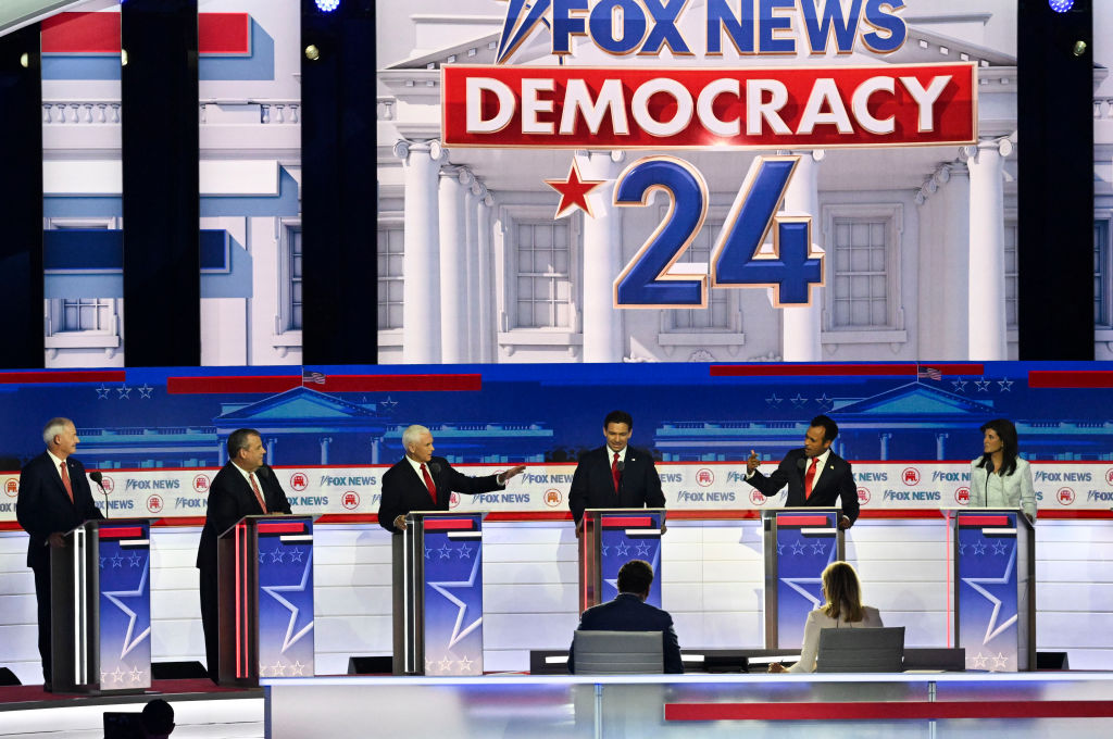 Former vice president Mike Pence, Florida Gov. Ron DeSantis and Vivek Ramaswamy speak in a debate hosted by Fox News in Milwaukee, Wisconsin, US, on Wednesday, Aug. 23, 2023 at the Fiserv Forum.