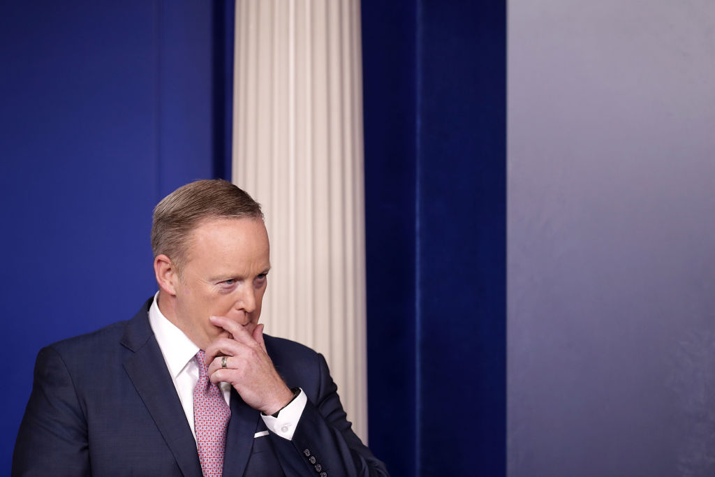 White House Press Secretary Sean Spicer listens to National Security Advisor H.R. McMaster during the daily news conference in the Brady Press Briefing Room at the White House May 12, 2017 in Washington, DC.