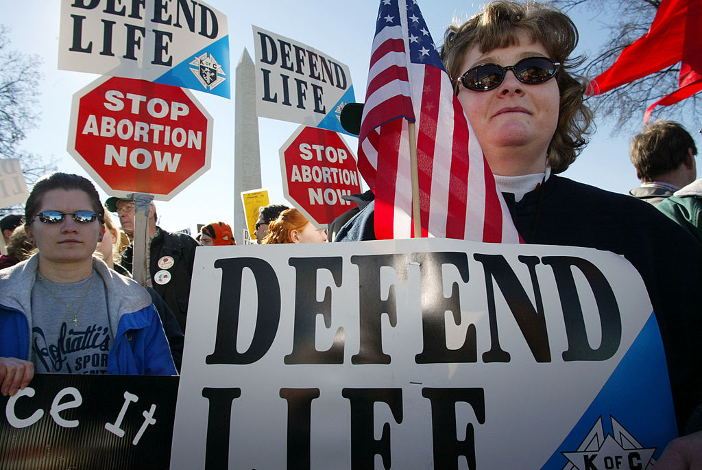 Pro-life activists Lori Gordon (R) and Tammie Miller (L) of Payne, OH take part in the annual "March for Life" event January 22, 2002 in Washington, DC.
