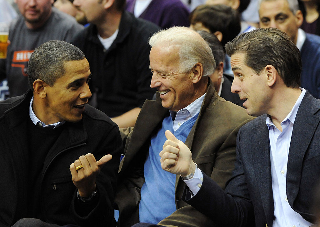 U.S. President Barack Obama (L) greets Vice President Joe Biden (C) and his son Hunter Biden as they attend the game between the Duke Blue Devils and Georgetown Hoyas on January 30, 2010 at the Verizon Center in Washington, DC.