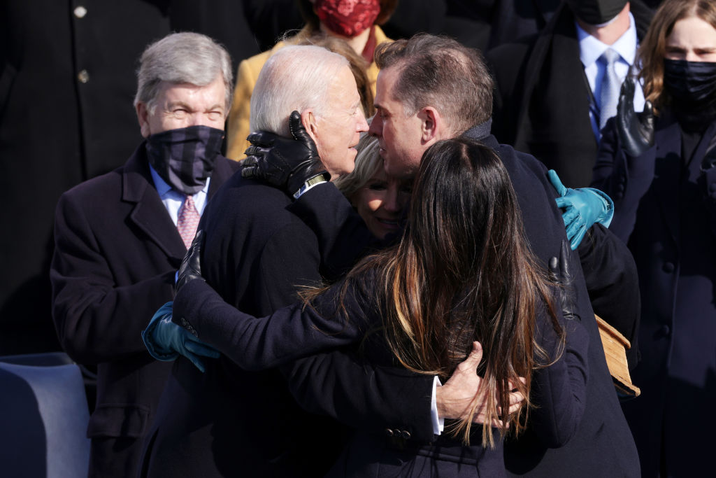 WASHINGTON, DC - JANUARY 20: U.S. President Joe Biden hugs his son Hunter Biden, wife Dr. Jill Biden and daughter Ashley Biden after being sworn in as U.S. president during his inauguration on the West Front of the U.S. Capitol on January 20, 2021 in Washington, DC.