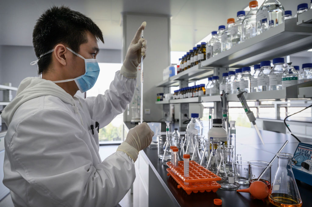 A technician works in a lab at Sinovac Biotech where the company is producing their potential COVID-19 vaccine CoronaVac during a media tour on September 24, 2020 in Beijing, China.