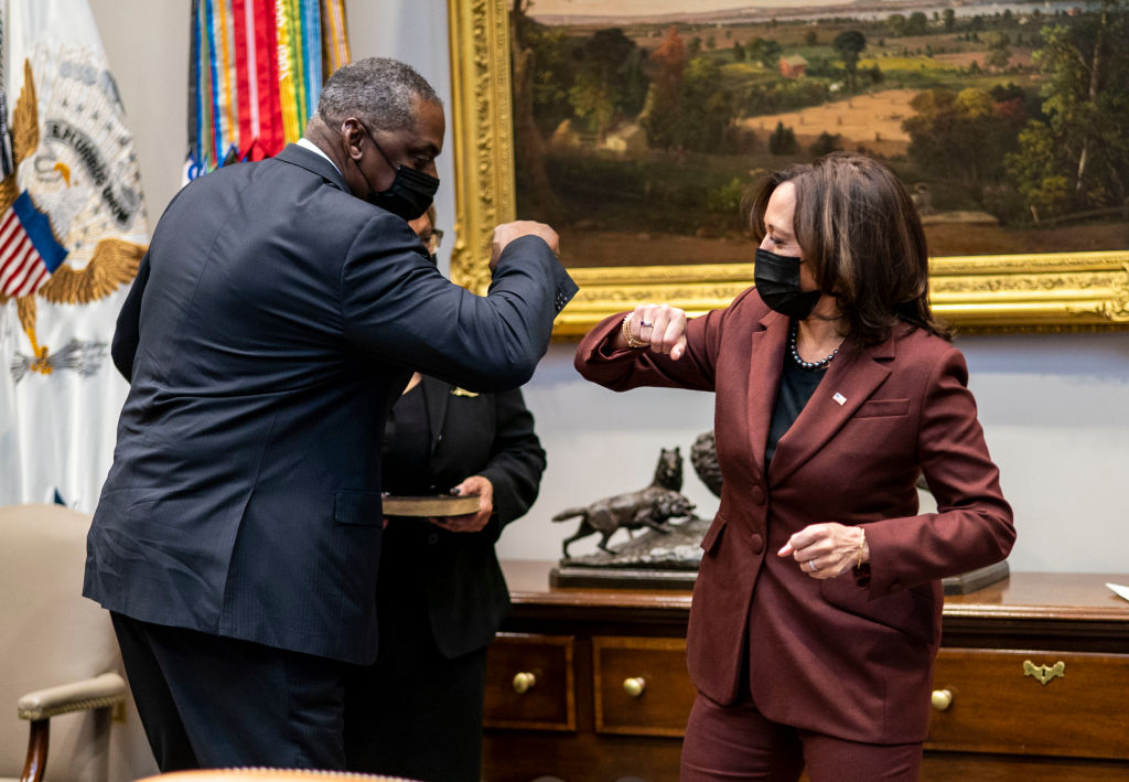 Secretary of Defense Lloyd Austin elbow bumps with U.S. Vice President Kamala Harris during his ceremonial swearing-in ceremony in the Roosevelt Room of the White House on January 25, 2021 in Washington, DC. On Monday, President Biden signed an executive order repealing the ban on transgender people serving openly in the military.