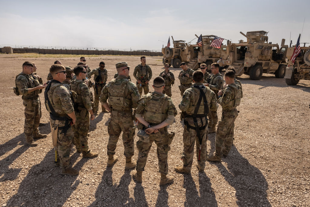 U.S. Army soldiers prepare to go out on patrol from a remote combat outpost on May 25, 2021 in northeastern Syria.
