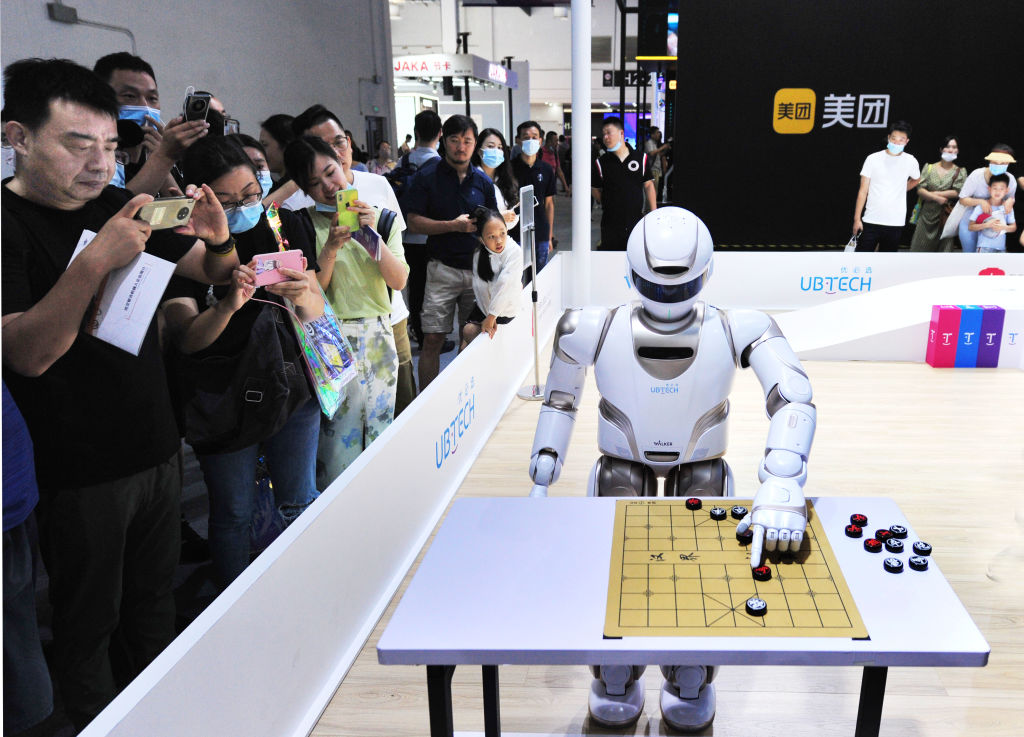 SHANGHAI, CHINA - JULY 08: An Ubtech Walker X Robot plays Chinese chess during 2021 World Artificial Intelligence Conference (WAIC) at Shanghai World Expo Center on July 8, 2021 in Shanghai, China.