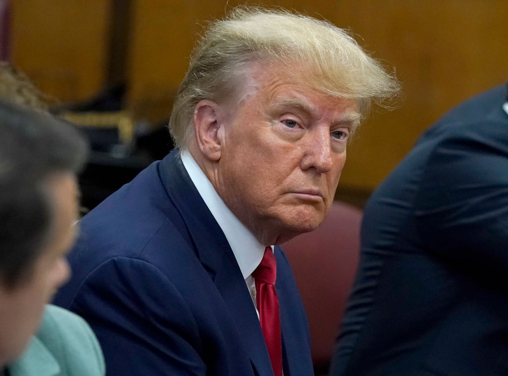 NEW YORK, NY - APRIL 04: Former U.S. President Donald Trump sits with his attorneys inside the courtroom during his arraignment at the Manhattan Criminal Court April 4, 2023 in New York City.