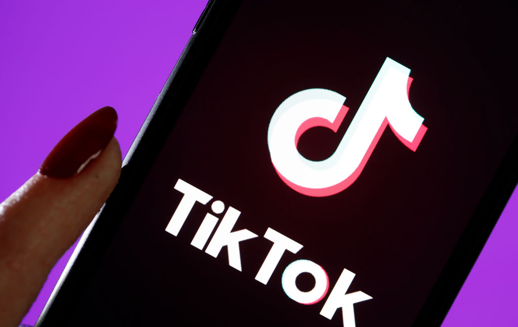 In this photo illustration, the social media application logo, Tik Tok is displayed on the screen of an iPhone on March 05, 2019 in Paris, France. The social network broke the rules for the protection of children's online privacy (COPPA) and was fined $ 5.7 million.