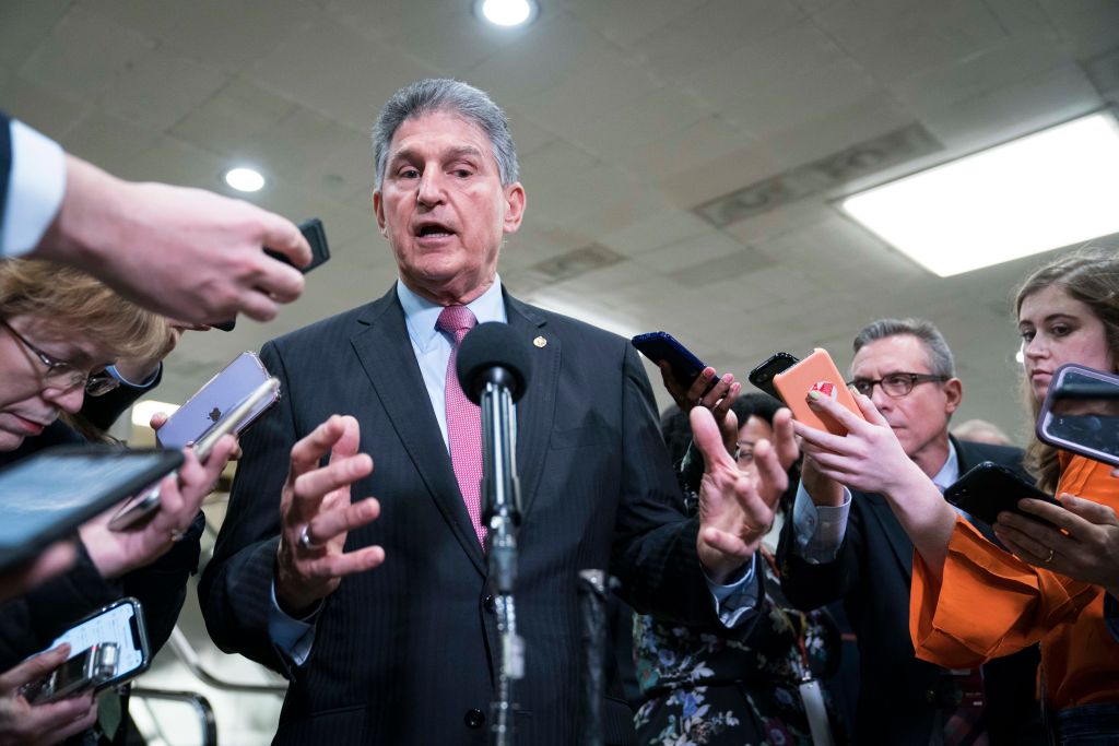 Senator Joe Manchin (D-WV) speaks to the press near the Senate subway following a vote in the Senate impeachment trial that acquitted President Donald Trump of all charges on February 5, 2020 in Washington, DC.