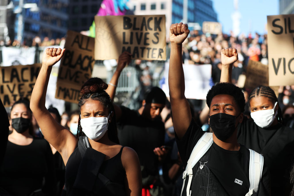 Protesters participate in a demonstration in solidarity with the Black Lives Matter movement and against police brutality at Sergels Torg on June 03, 2020 in Stockholm, Sweden.