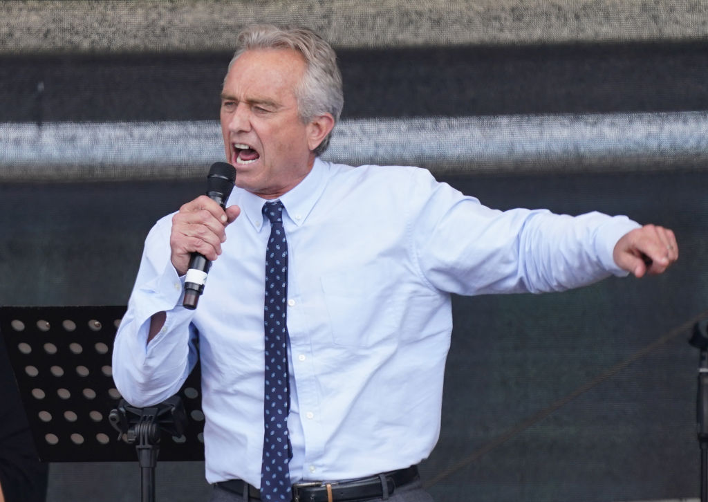 Robert F. Kennedy Jr., nephew of former U.S. President John F. Kennedy, speaks to people from a wide spectrum, including coronavirus skeptics, conspiracy enthusiasts, right-wing extremists, religious conservatives, hippies and others gathered under the Victory Column in the city center to hear speeches during a protest against coronavirus-related restrictions and government policy on August 29, 2020 in Berlin, Germany.