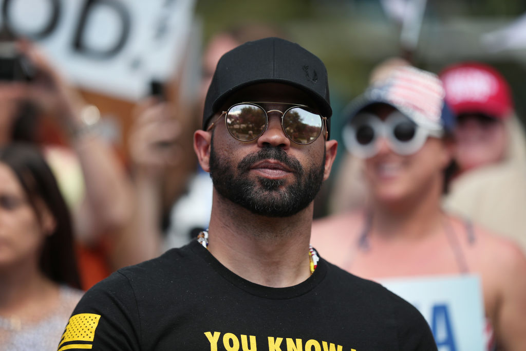 Enrique Tarrio, leader of the Proud Boys, stands outside of the Hyatt Regency where the Conservative Political Action Conference is being held on February 27, 2021 in Orlando, Florida.