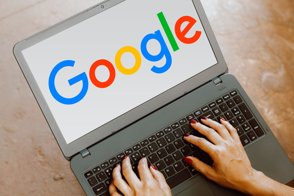 In this photo illustration, the Google logo is displayed on a laptop screen.