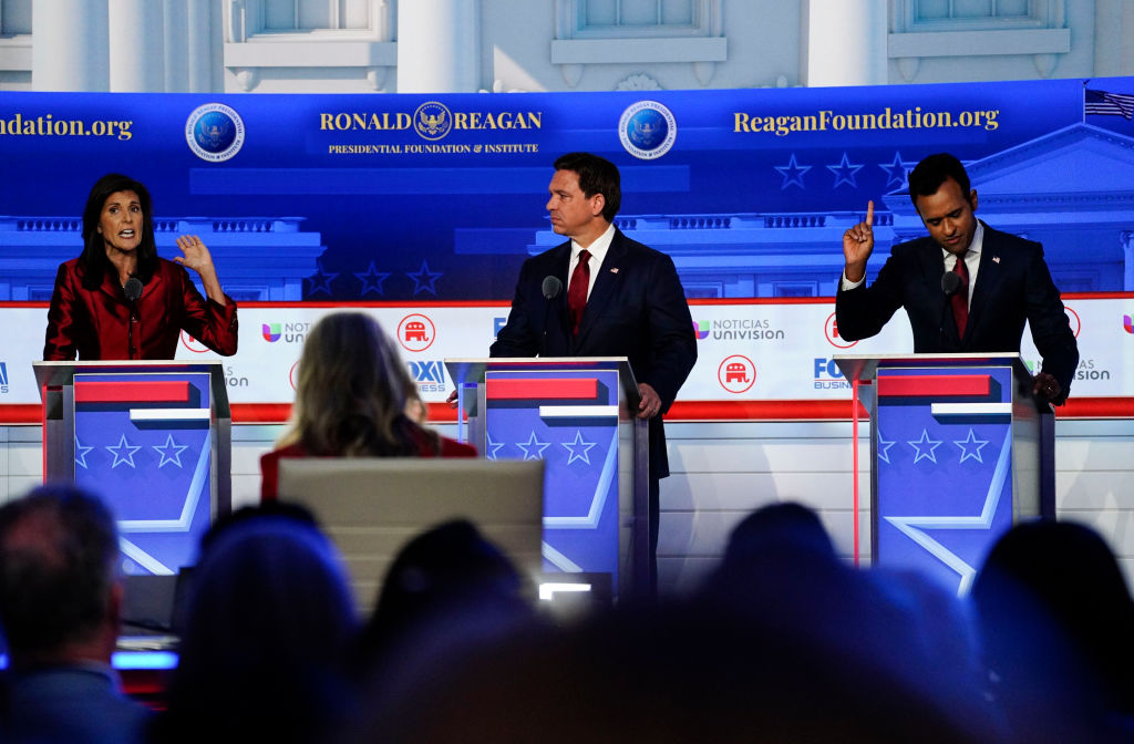 Former South Carolina governor Nikki Haley and Vivek Ramaswamy speak as Florida Gov. Ron DeSantis listens during the second Republican presidential primary debate hosted by Fox News at Ronald Reagan Presidential Library in Simi Valley, Calif., Wednesday, September 27, 2023.