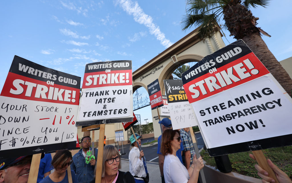 Picketers walk the picket line outside Paramount Studios on September 22, 2023 in Los Angeles, California. Members of SAG-AFTRA and WGA (Writers Guild of America) have both walked out in their first joint strike against the studios since 1960.