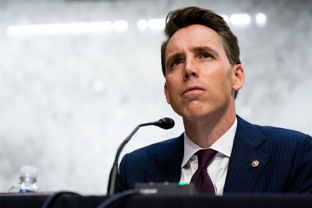 U.S. Sen. Josh Hawley (R-MO) listens while Supreme Court nominee Judge Amy Coney Barrett testifies before the Senate Judiciary Committee on the second day of her Supreme Court confirmation hearing on Capitol Hill on October 13, 2020 in Washington, DC.