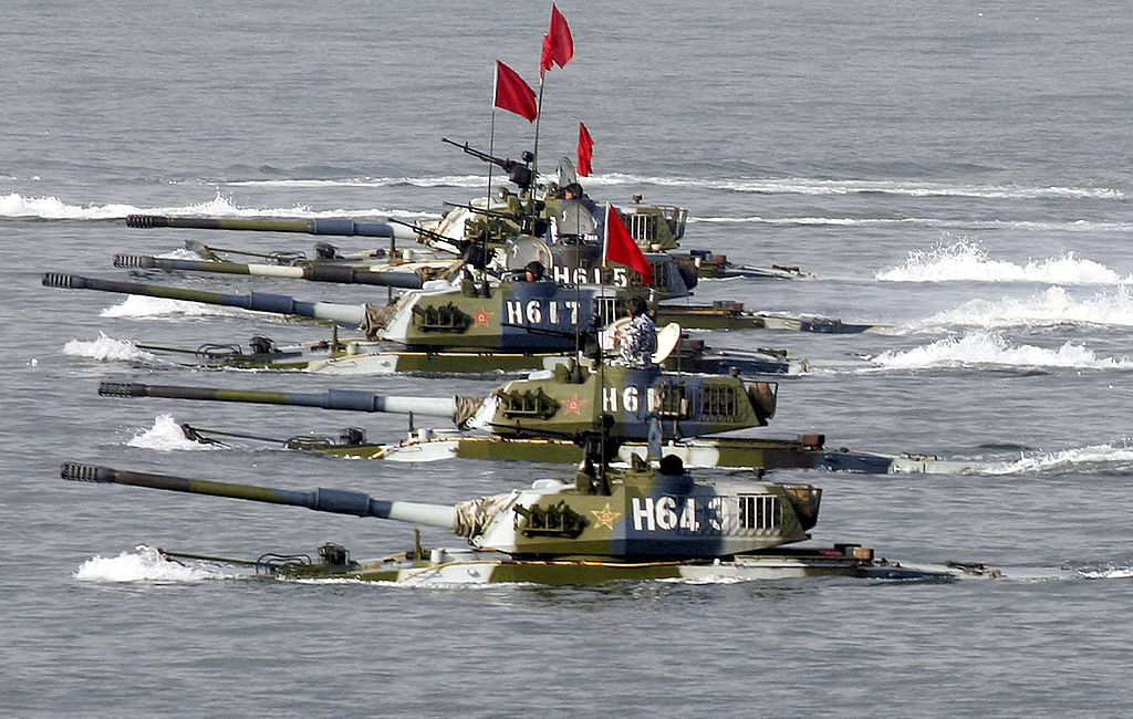 Amphibious tanks of the Chinese People's Liberation Army move to land a beach during the second phase of the Sino-Russian joint military exercise on August 22, 2005 near Qingdao of Shandong Peninsular, China.