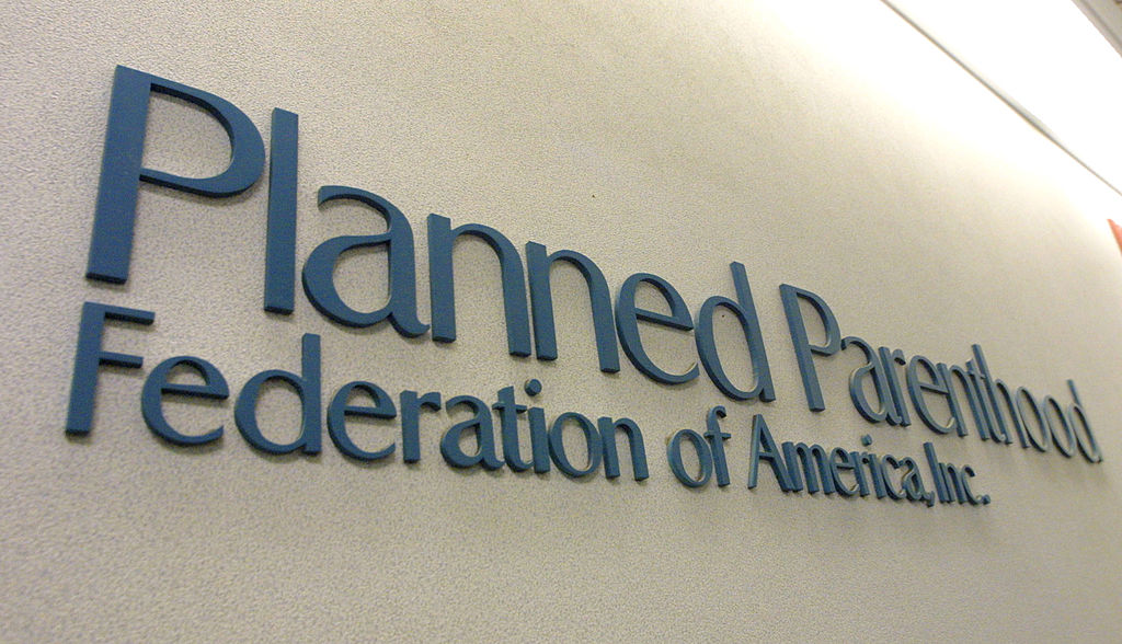 A sign hangs in the offices of the Planned Parenthood Federation of America December 7, 2001 in New York City.